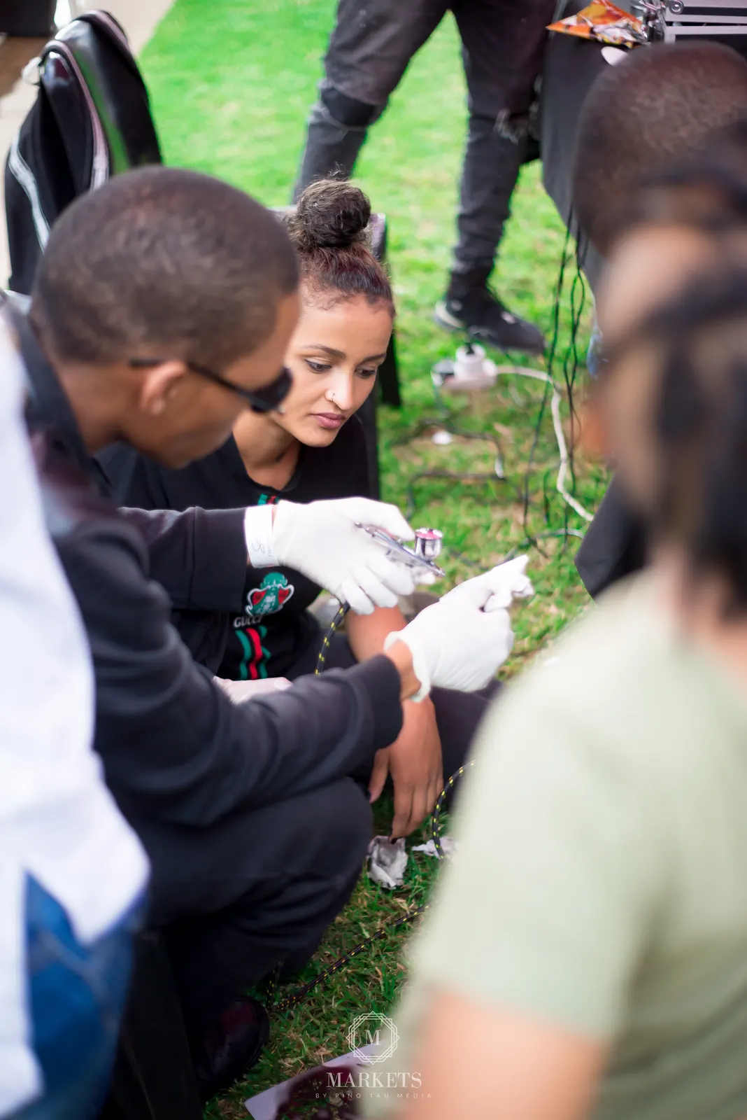 Airbrush work on the grass at an outdoor event