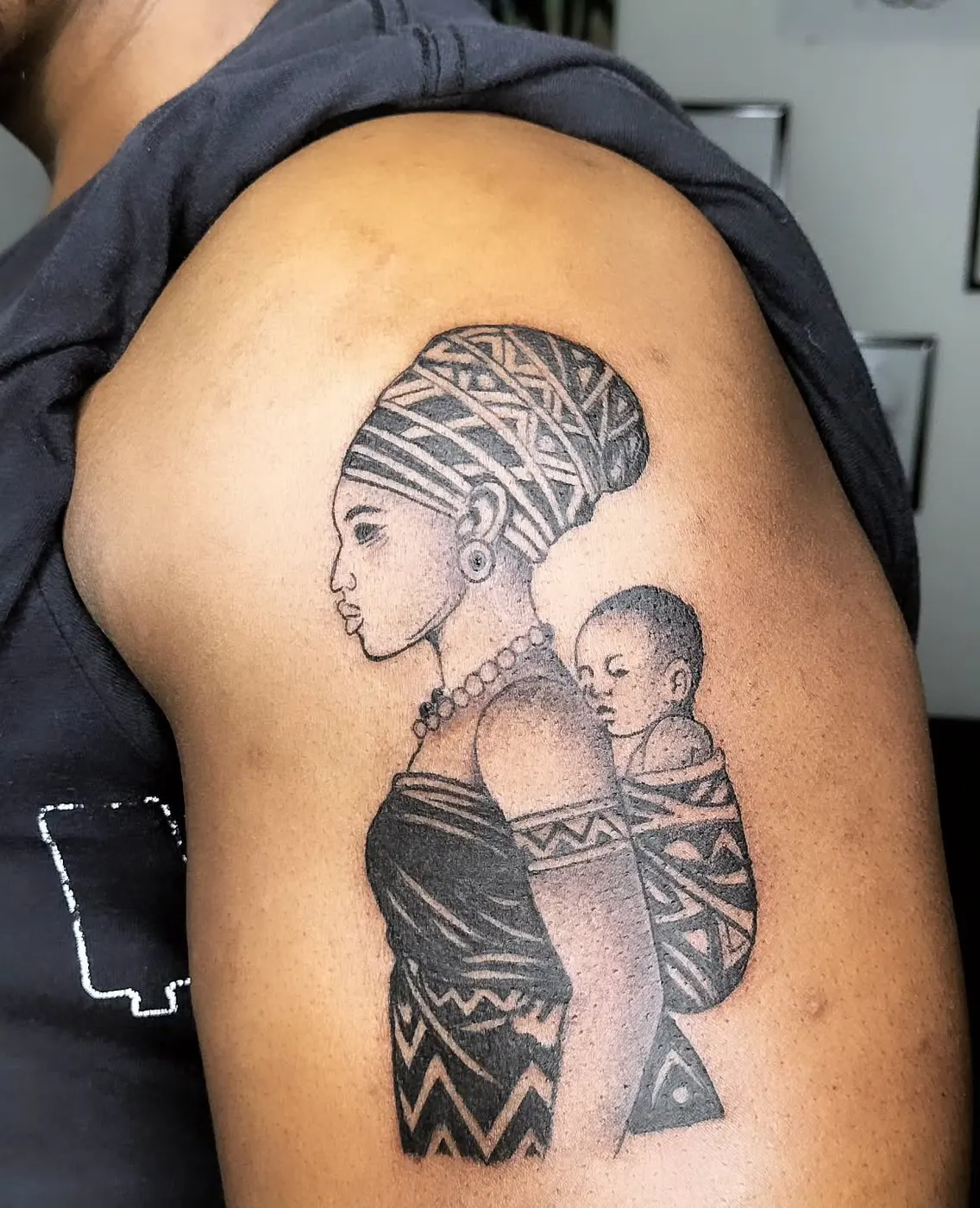 Mother and child blackwork tattoo by Payne