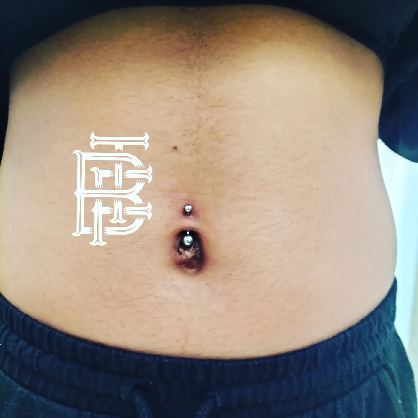 Navel piercing done at BlaQ Feather
